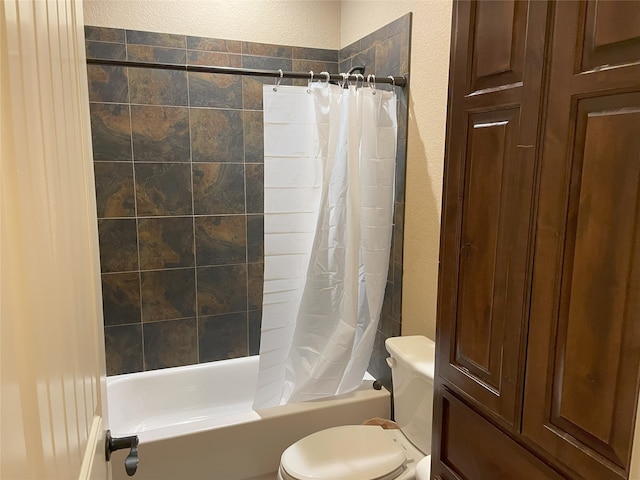 bathroom featuring toilet and shower / bath combo with shower curtain