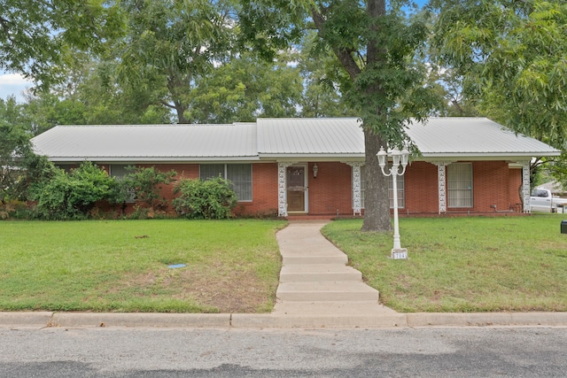 ranch-style home featuring a front yard