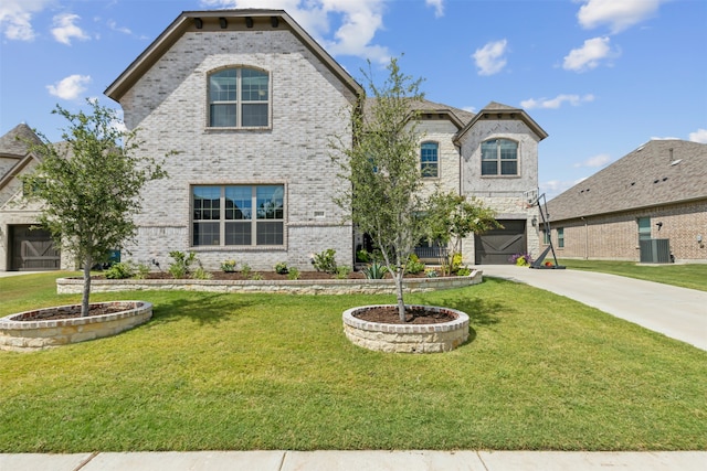 view of front of property with a garage and a front yard