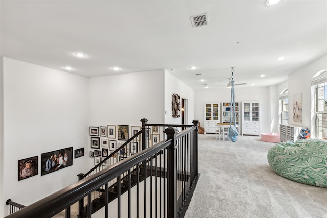 corridor with carpet flooring