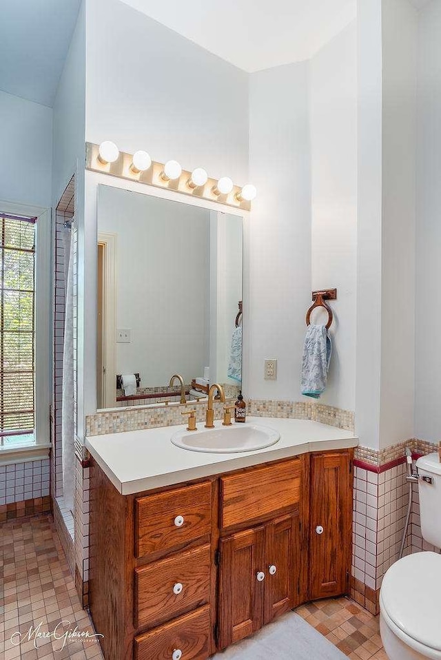 bathroom with tile patterned floors, vanity, and toilet