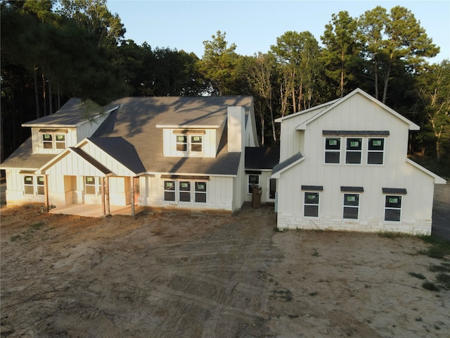 back of property featuring a patio