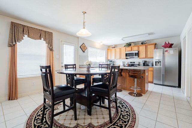 view of tiled dining space