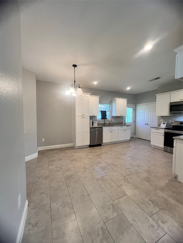 unfurnished living room with a raised ceiling and ceiling fan