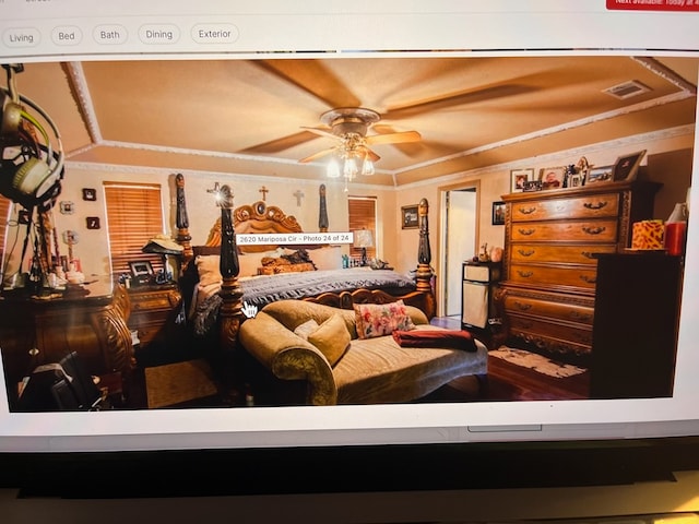 bedroom featuring ceiling fan and crown molding