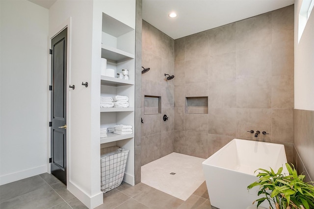 full bathroom with tile patterned floors, a soaking tub, built in features, and tiled shower