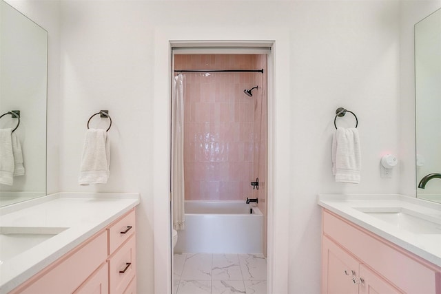 bathroom with vanity, shower / tub combo, toilet, and marble finish floor