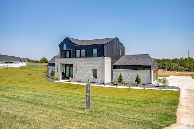 modern farmhouse style home with board and batten siding, concrete driveway, a garage, and a front yard