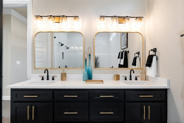 bathroom featuring hardwood / wood-style floors, vanity, a shower, and ornamental molding