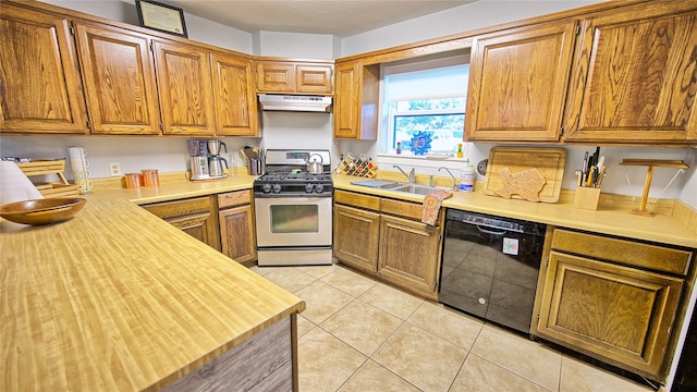 kitchen featuring sink, dishwasher, range with gas stovetop, and light tile patterned floors