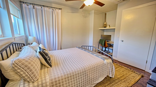 bedroom with ceiling fan and wood-type flooring