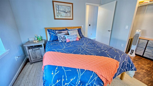 bedroom featuring a closet and hardwood / wood-style flooring