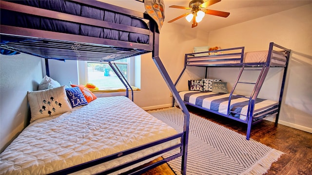 bedroom with ceiling fan and wood-type flooring