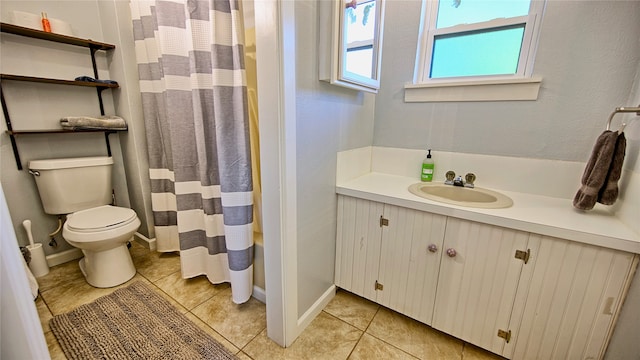 bathroom with tile patterned flooring, toilet, a shower with shower curtain, and vanity