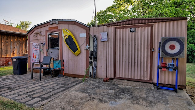 view of gate featuring a shed