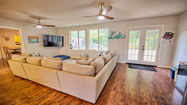 living room featuring ceiling fan, dark hardwood / wood-style flooring, and french doors