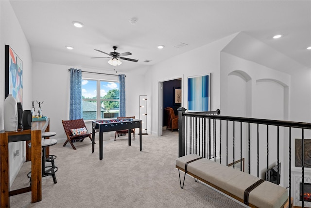 carpeted office with ceiling fan