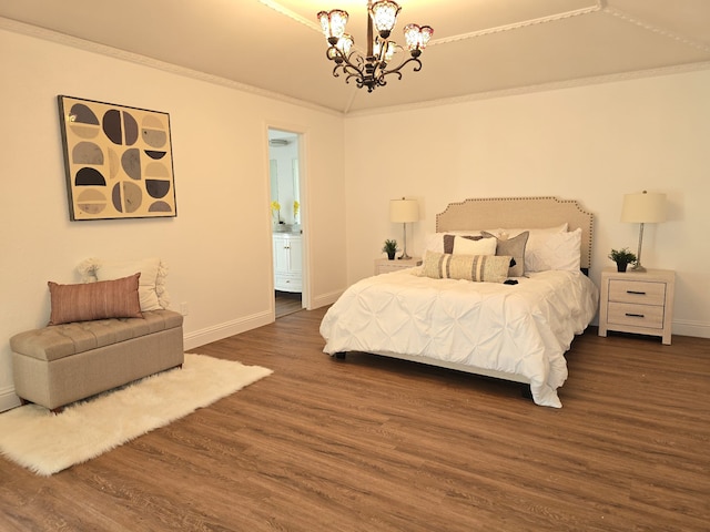 bedroom featuring ornamental molding, a chandelier, connected bathroom, and dark hardwood / wood-style floors