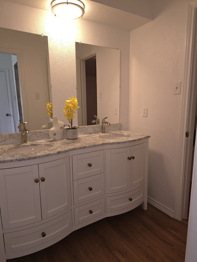 bathroom featuring hardwood / wood-style floors and vanity