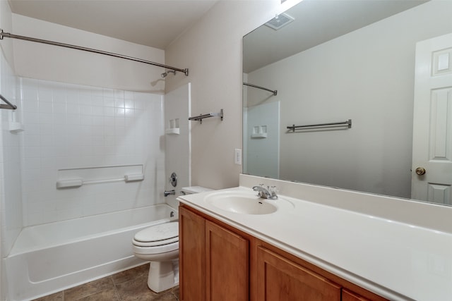 full bathroom featuring tile patterned flooring, vanity, toilet, and tiled shower / bath