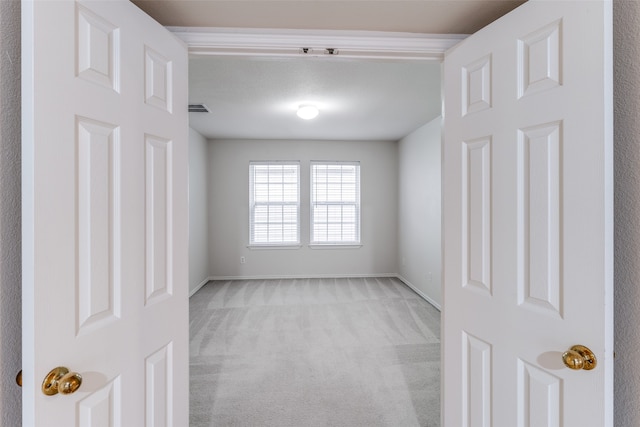 unfurnished room with light carpet