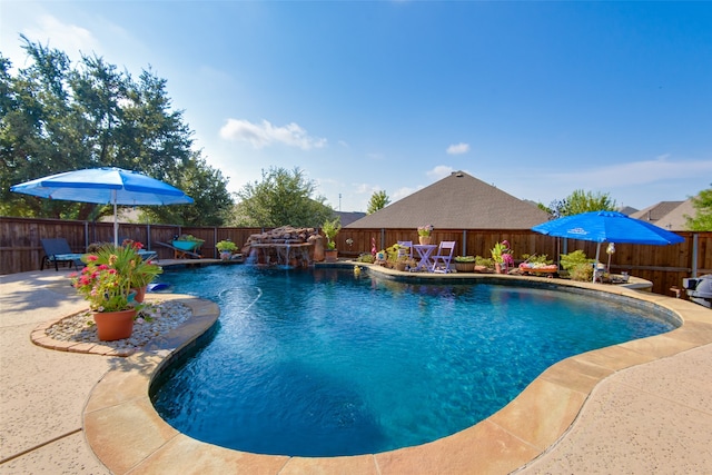 view of pool with pool water feature and a patio area