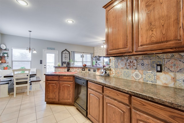 kitchen with tasteful backsplash, kitchen peninsula, sink, black dishwasher, and light tile patterned flooring