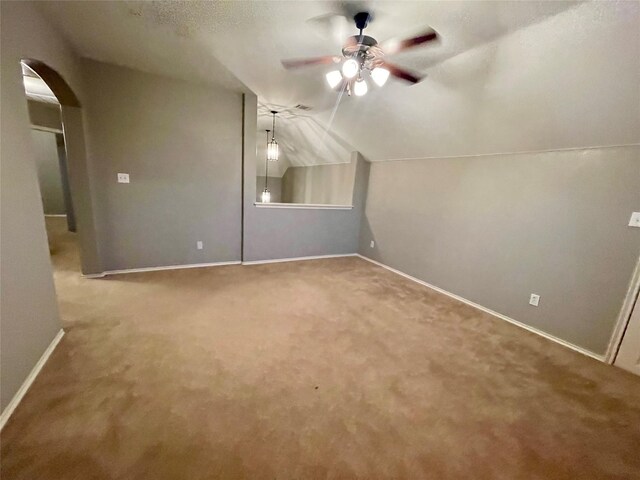 living room featuring lofted ceiling, carpet flooring, and ceiling fan