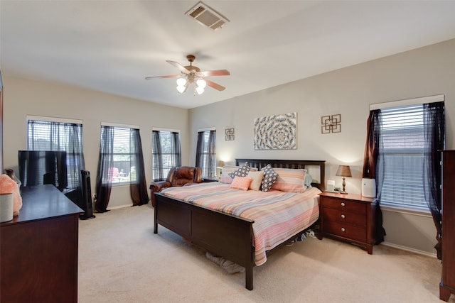 bedroom featuring ceiling fan and light carpet