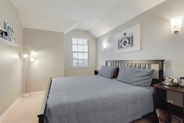 carpeted bedroom featuring vaulted ceiling