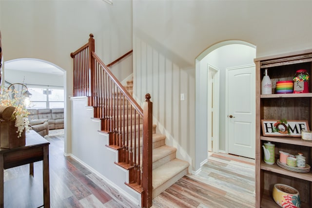 staircase with wood-type flooring