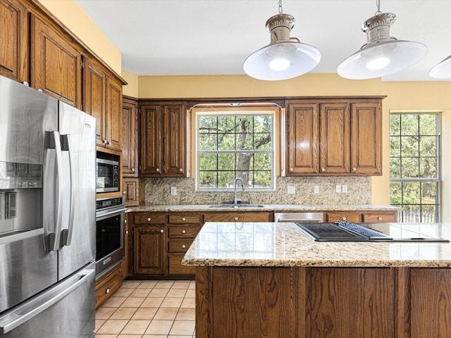 kitchen featuring decorative backsplash, appliances with stainless steel finishes, light tile patterned floors, and sink