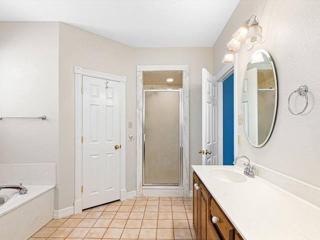 bathroom with tile patterned flooring, vanity, and independent shower and bath