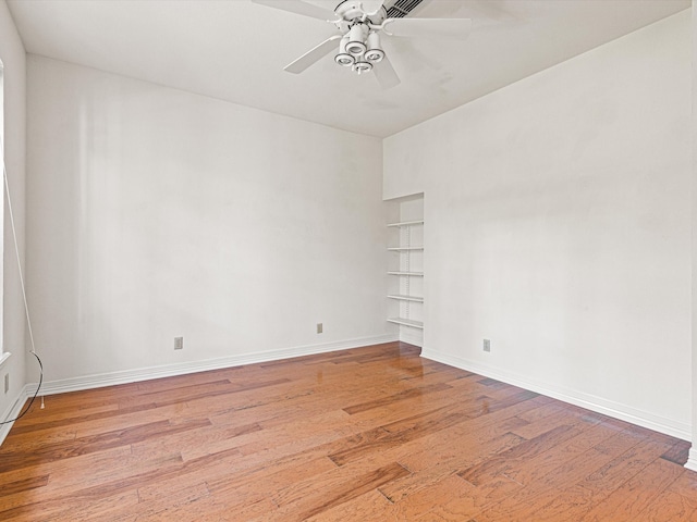 empty room featuring ceiling fan and light wood-type flooring