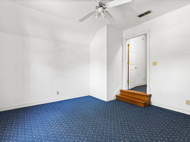 bonus room with ceiling fan, vaulted ceiling, and dark colored carpet