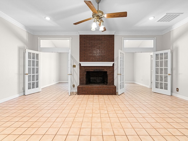 unfurnished living room featuring a fireplace, crown molding, and french doors