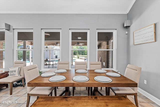 tiled dining room with a wealth of natural light and ornamental molding