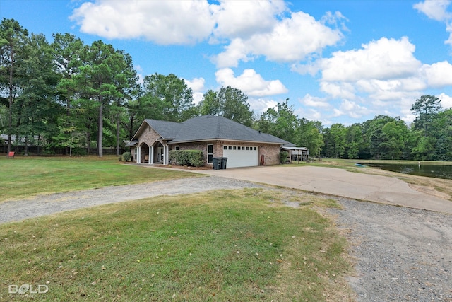 single story home with a garage and a front yard