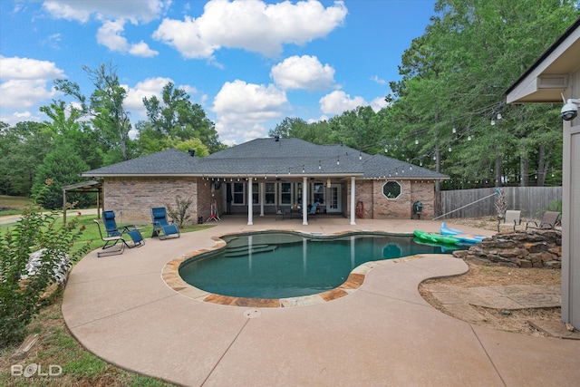 view of swimming pool with a patio area