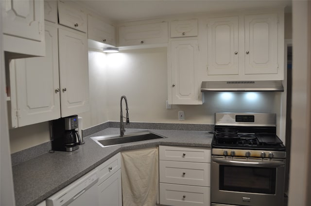 kitchen featuring white cabinetry, stainless steel gas range oven, extractor fan, and sink