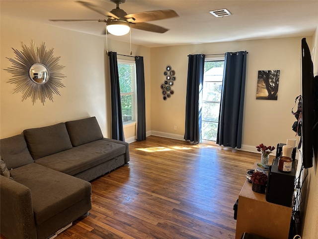 living room featuring a wealth of natural light, ceiling fan, and hardwood / wood-style floors