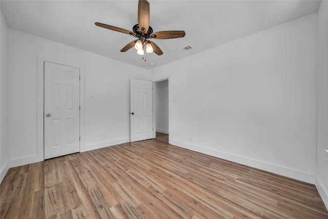 unfurnished bedroom featuring light hardwood / wood-style flooring and ceiling fan