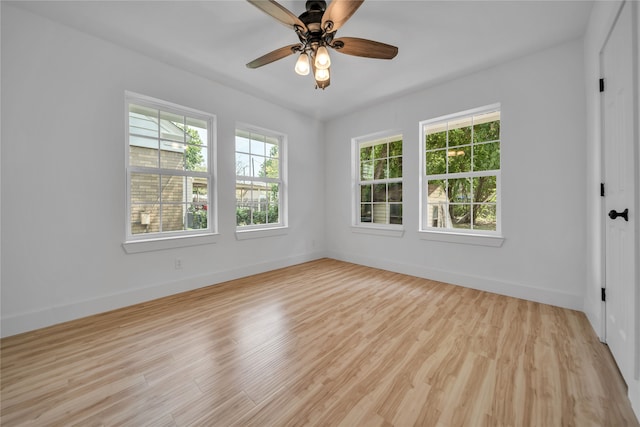 unfurnished room featuring light wood-type flooring and ceiling fan