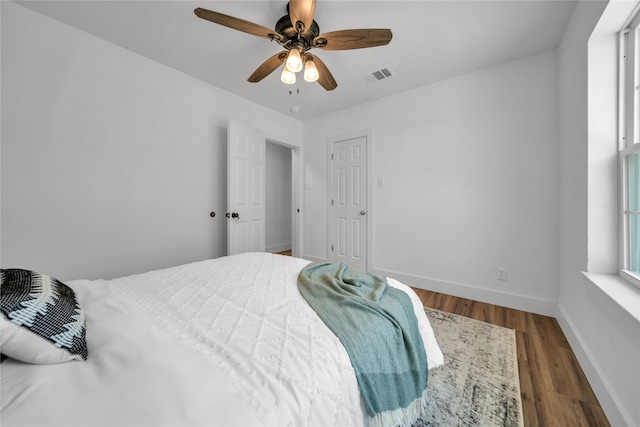 bedroom featuring dark wood-type flooring and ceiling fan