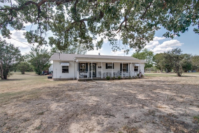 single story home featuring covered porch