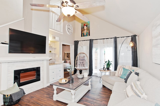 living room with ceiling fan, high vaulted ceiling, and dark hardwood / wood-style floors