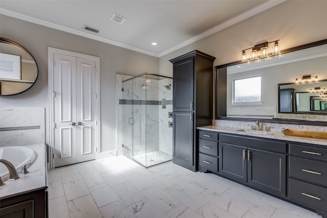 bathroom featuring independent shower and bath, ornamental molding, and vanity