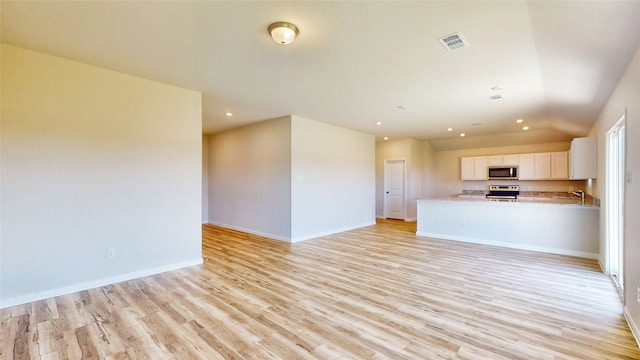 unfurnished living room featuring light hardwood / wood-style flooring