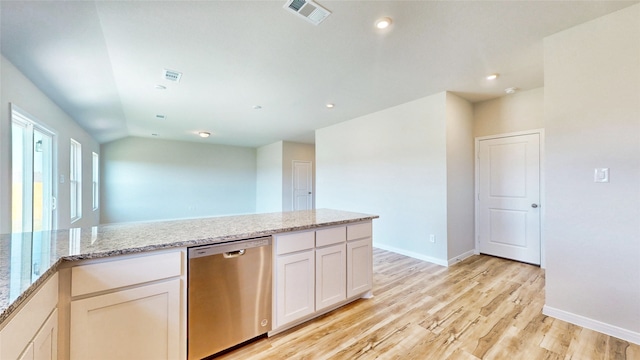 kitchen featuring light stone countertops, white cabinetry, light hardwood / wood-style floors, and dishwasher