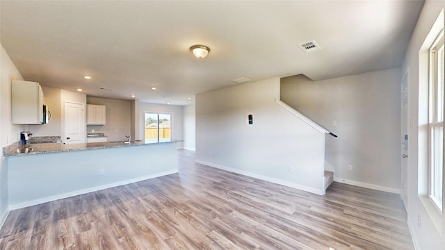 unfurnished living room with light hardwood / wood-style floors